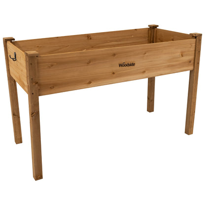 Woodside raised wooden garden bed planter with plants and vegetables, ideal for growing herbs and vegetables in a home garden.