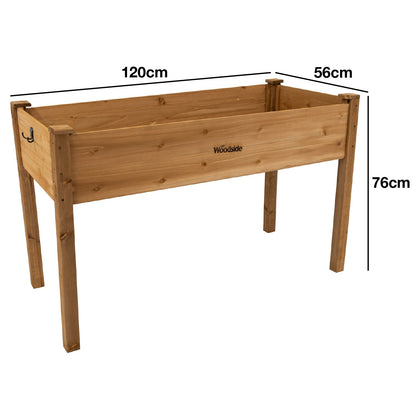 Woodside raised wooden garden bed planter with plants and vegetables, ideal for growing herbs and vegetables in a home garden.