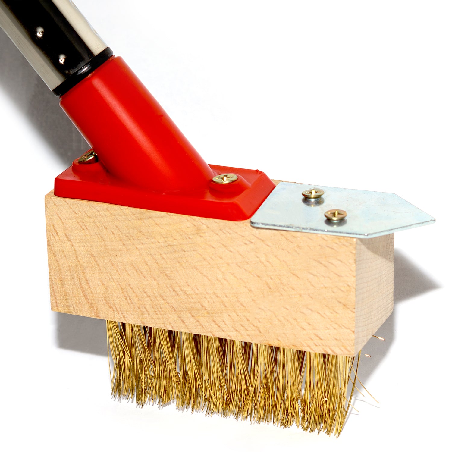 Cleaning brush with red handle and wooden base on a white background