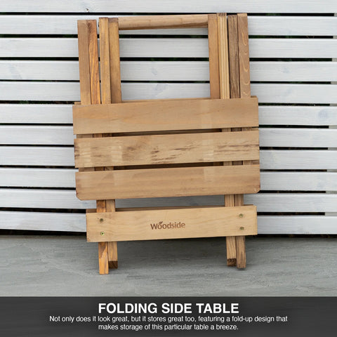 Wooden folding side table with 'Woodside' branding against a slatted wall background.