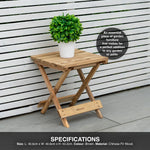 Wooden folding table with a plant on it against a white wooden fence.